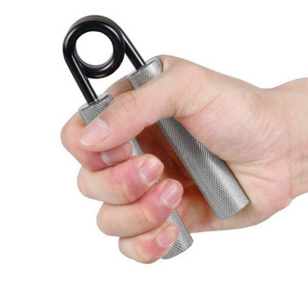 A hand holding a small pair of scissors